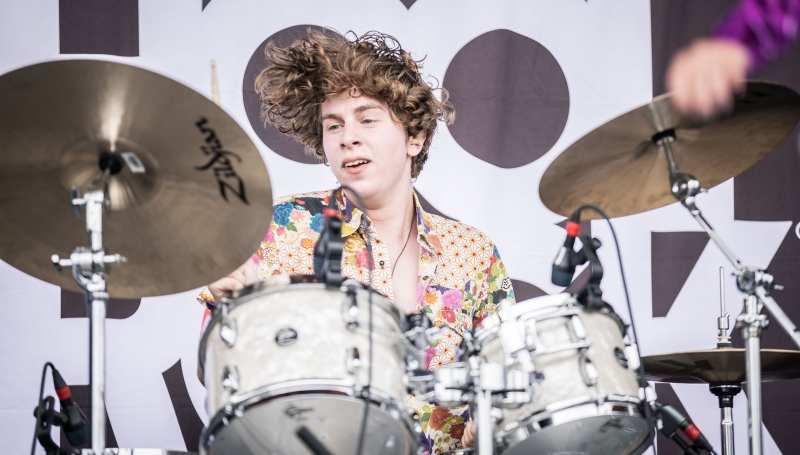 School of Rock student drumming on stage